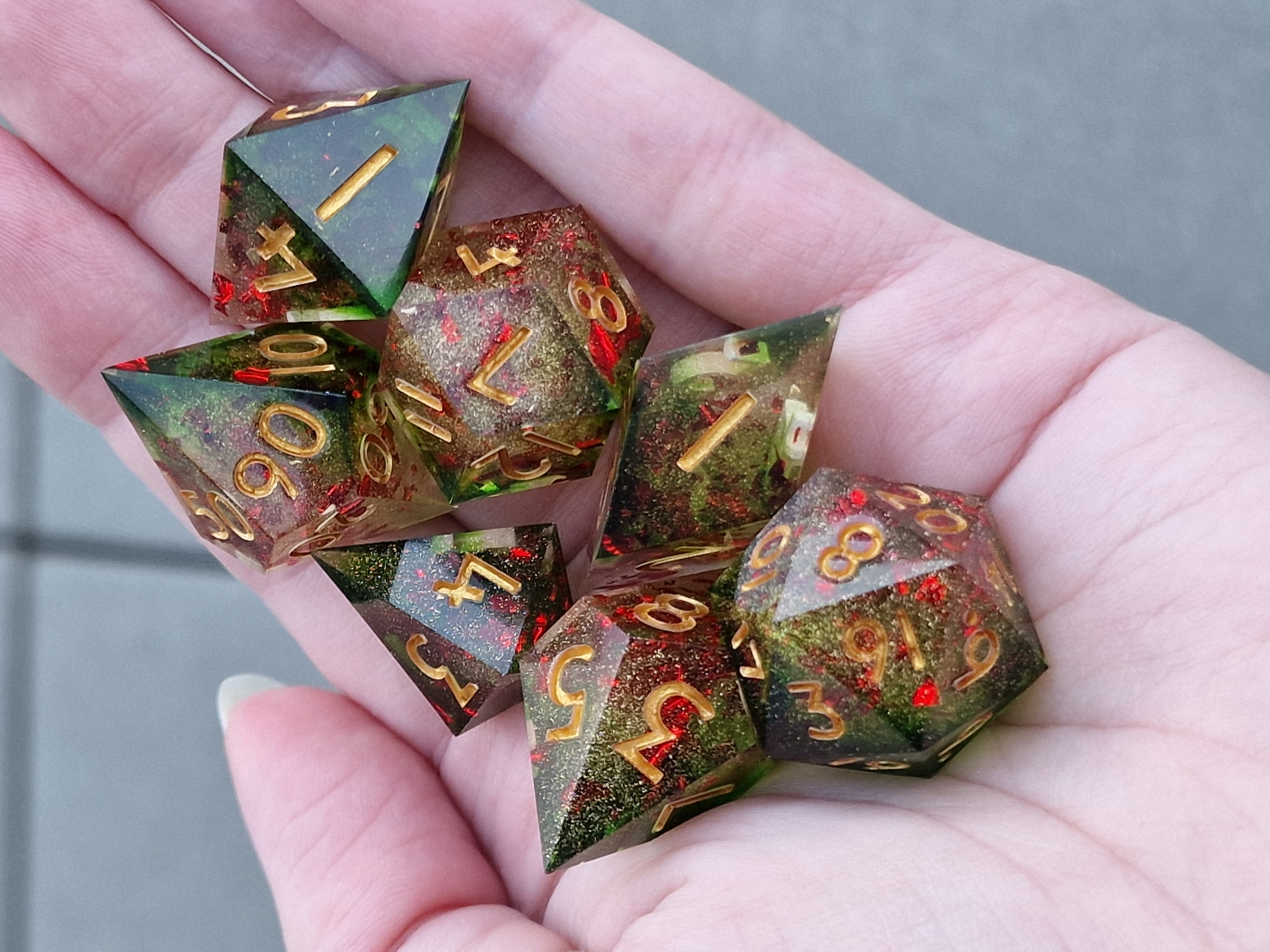 Evergreen resin, ruby-red fragments, and golden shimmer bring a festive glow to these gilded shards.
